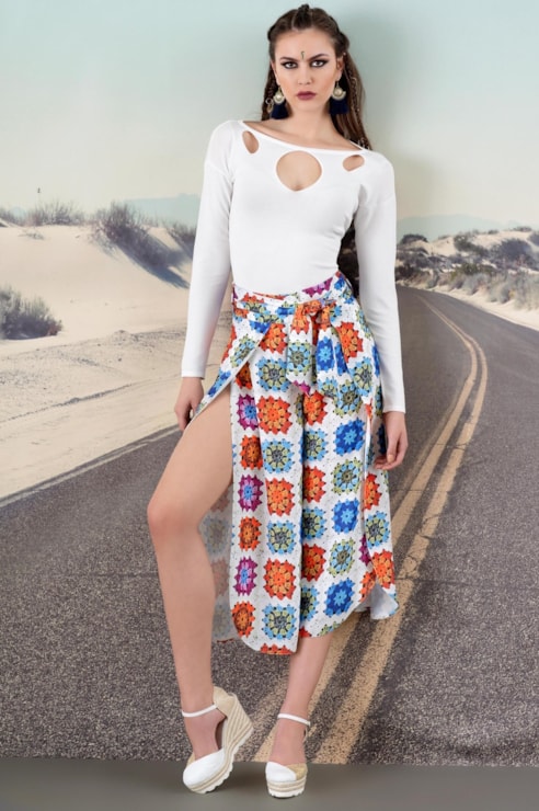 Knitted sweater with openings